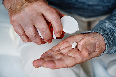 Elderly taking a pill bought from online canadian pharmacy Elderly taking a pill bought from online canadian pharmacy